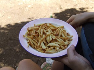 This region of Haiti grows excellent potatoes. Here we take a mid-morning break for some hot, salty french fries and fresh Haitian coffee. Delicious. . .
